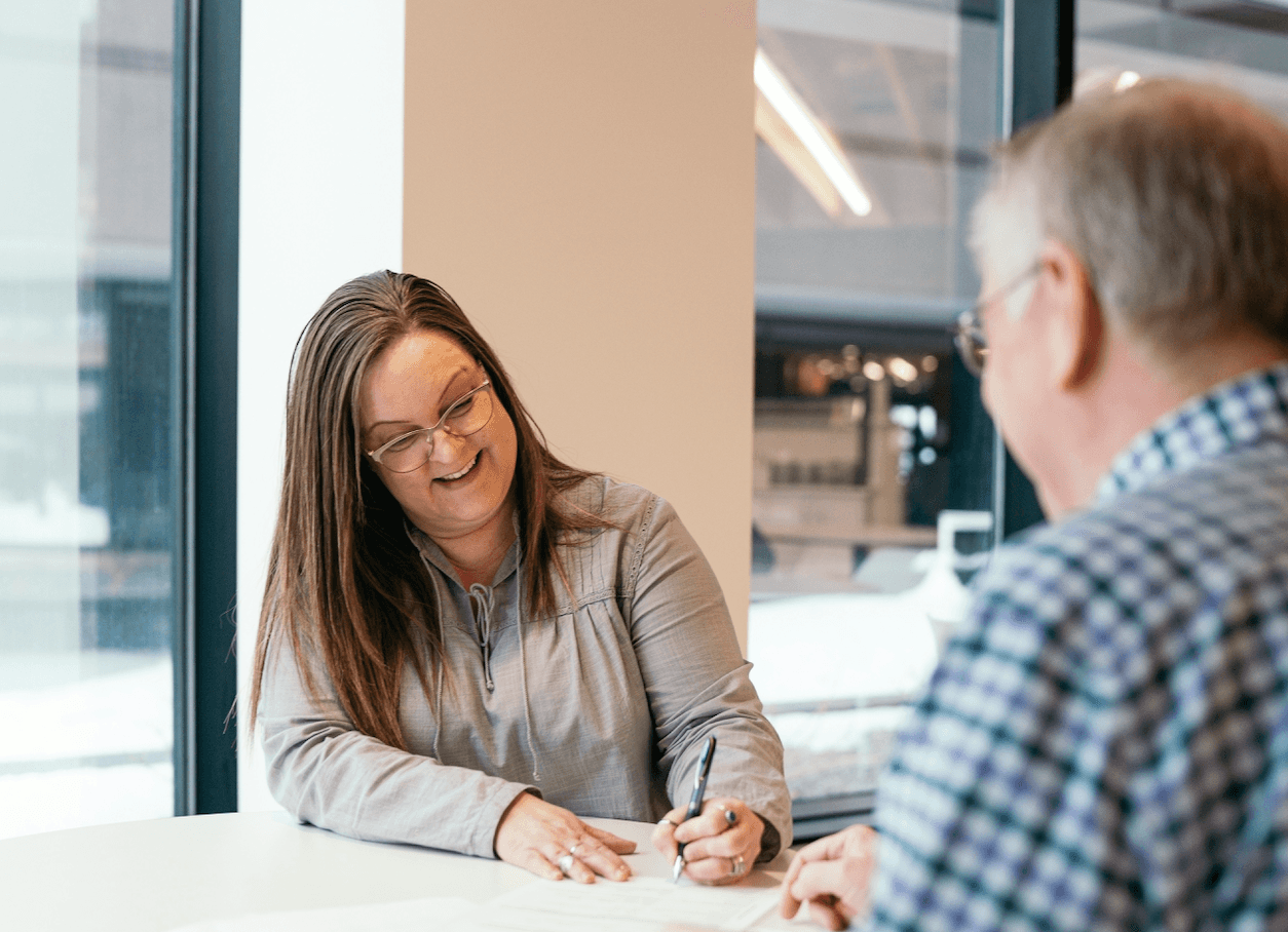Realtor leading a first-time homebuyer workshop in a local community.