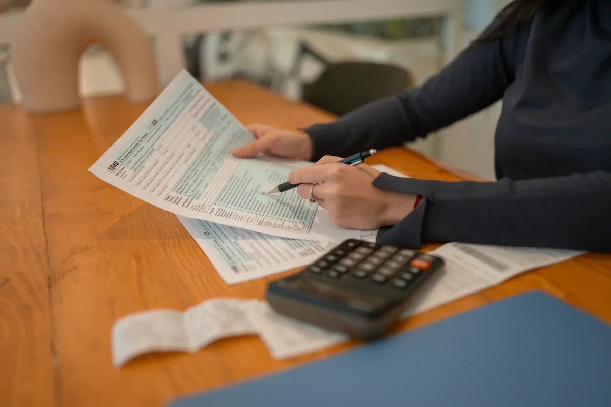 A detailed pricing document showing transparent costs with a magnifying glass highlighting clear, itemized fees and no hidden charges